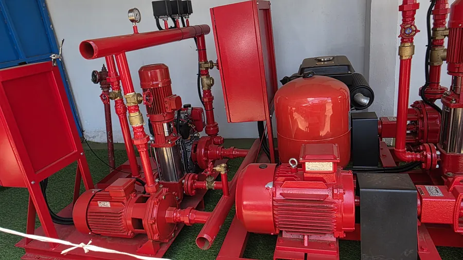 Red fire pump set with jockey pump, pressure vessel, gauges and control panel